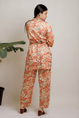 Orange floral co-ord set with ethnic belt.