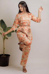 Orange floral co-ord set with ethnic belt.