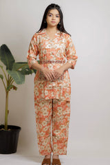 Orange floral co-ord set with ethnic belt.